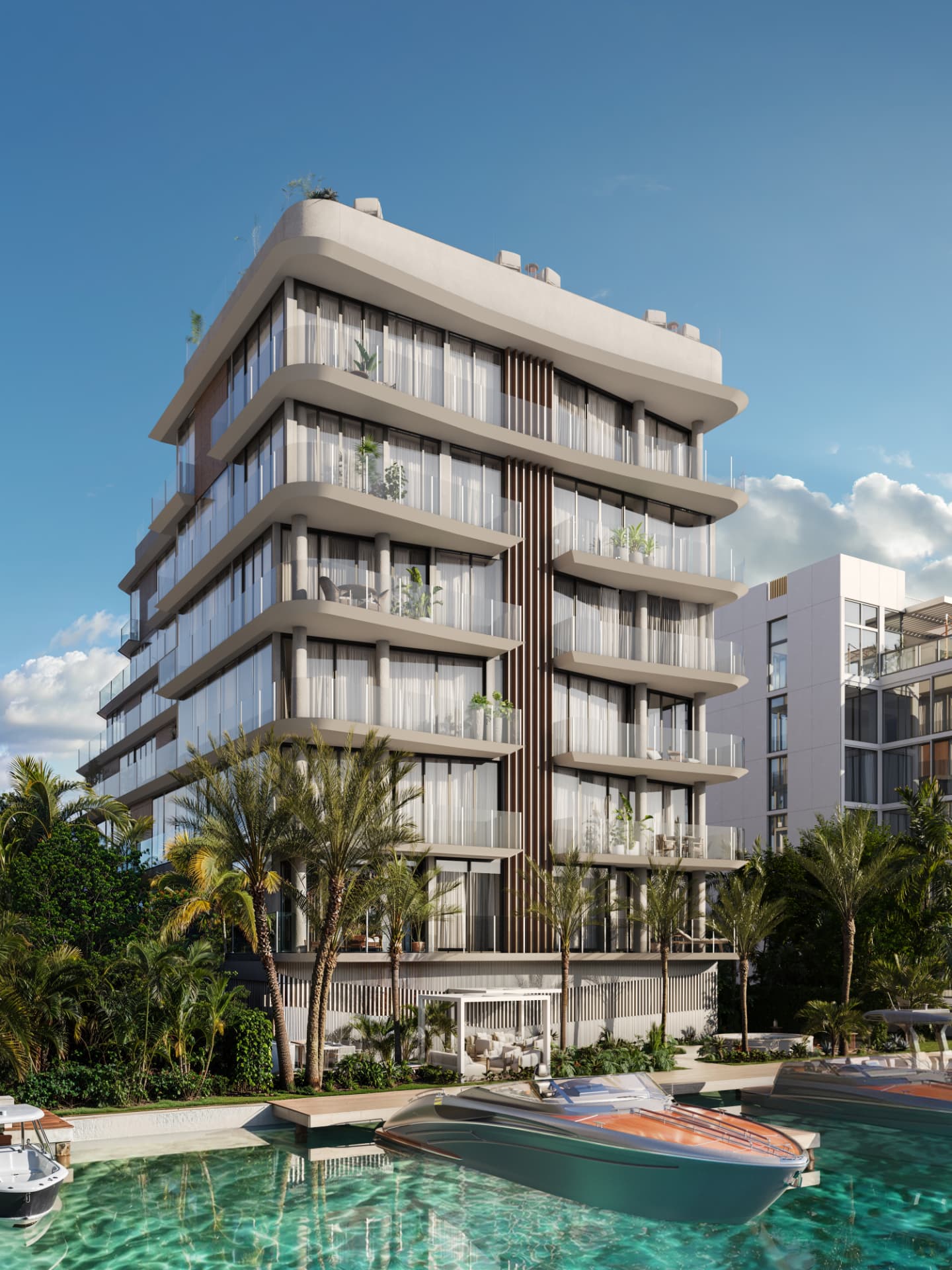 ola Bay Harbor waterfront façade rising above its private marina and turquoise bay water