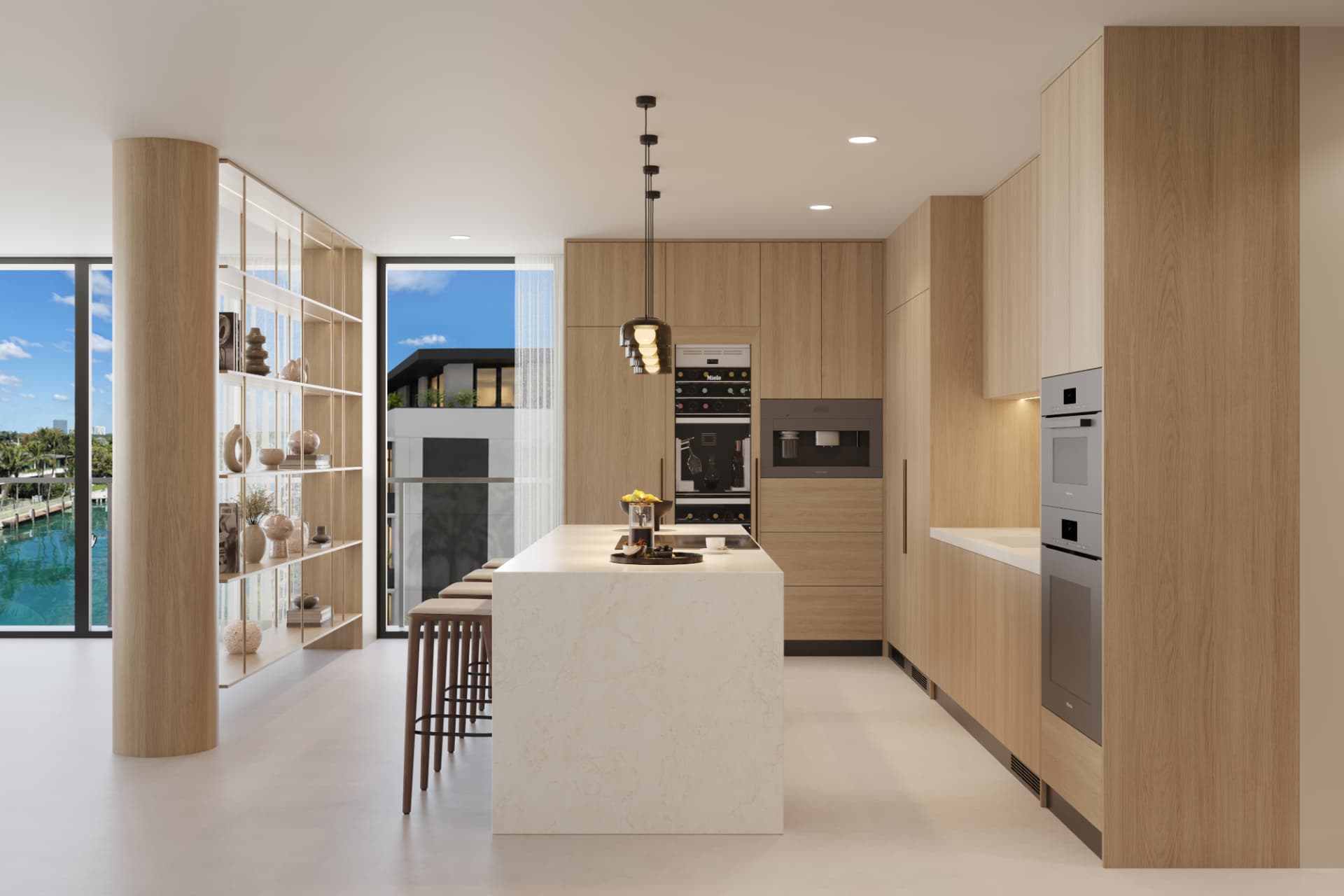 ola residence kitchen with integrated appliances and a view toward the water