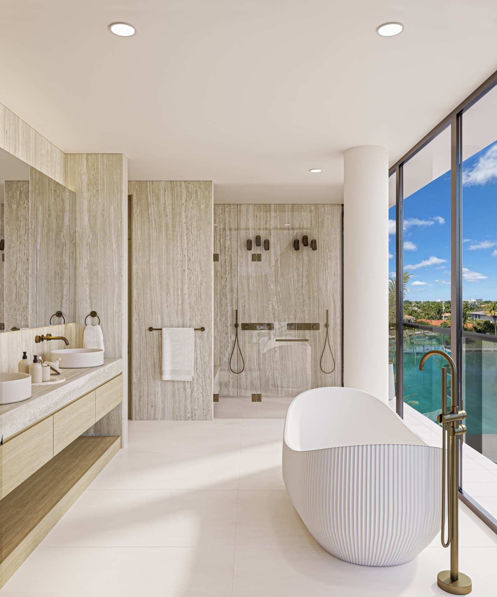 ola residence 501 primary bathroom with double showers, soaking tub and a waterfront view